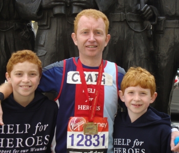 Craig with medal..and mascots., 