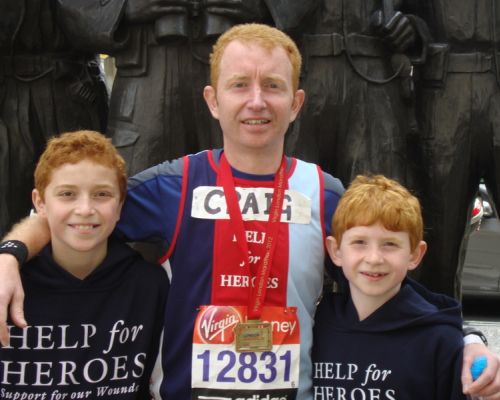 Craig with medal..and mascots.